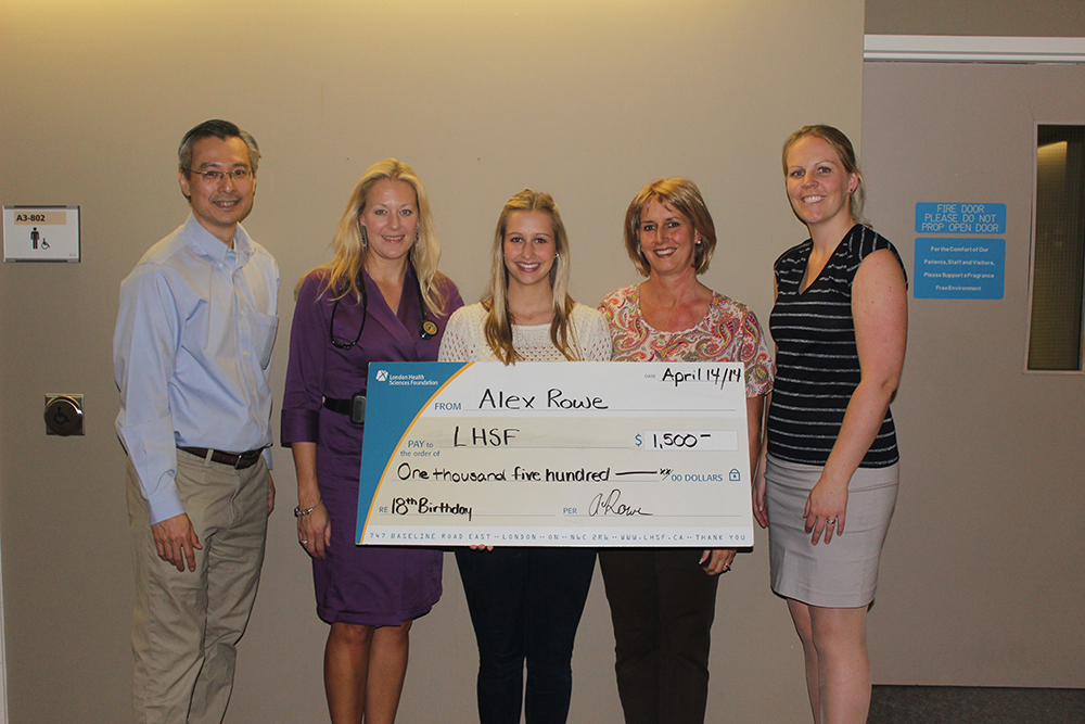 Alex Rowe presents large cheque to the Act Now program at LHSC.