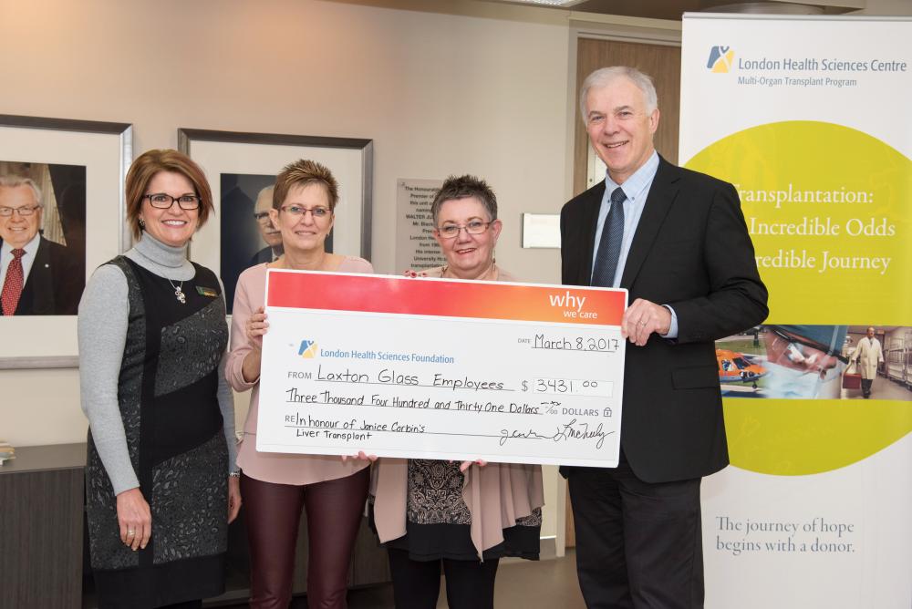 Transplant recipient Janice Corbin and her colleague Louise McNeely of Laxton Glass LLP present their law office’s donation to LHSC’s Deborah Kuhar and Dr. Anthony Jevnikar