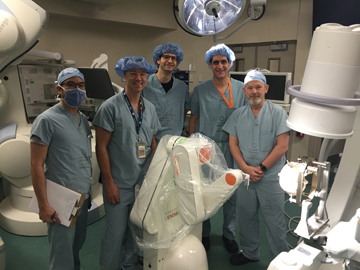 From left: Dr. Jonathan Lau, Dr. Kieth MacDougall, Dr. Holger Joswig, Dr. David Steven and Dr. Andrew Parrent. London Health Sciences Centre (LHSC) neurosurgeons pose for a photo during a training session on the hospital's newly acquired Renishaw Neuromate stereotactic surgical robot.