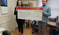 Devony Lescadres, Sales Manager, Days Inn London, presents a cheque for $25,000 to Dr. Beth Osuch