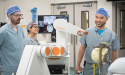Dr. Lau and team with the robot