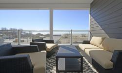 Spring is here, summer is on its way and a sun-filled balcony of the Dream Condo, overlooking the beach in Port Stanley, beckons.