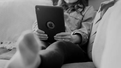 Person on couch with iPad