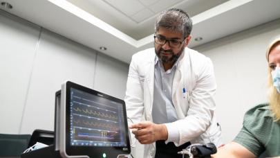 man pointing to computer