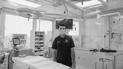 Nazem Kadri wears a mask in front of a new piece of equipment in the surgical centre