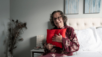 Mary Watts holding Heart Pillow