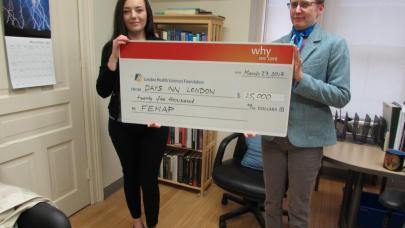 Devony Lescadres, Sales Manager, Days Inn London, presents a cheque for $25,000 to Dr. Beth Osuch