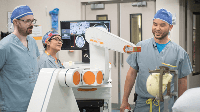 Dr. Lau and team with the robot