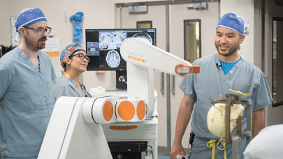 Dr. Lau and team with the robot