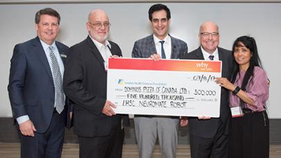 Michael Schlater and his wife Lillibeth Present Cheque