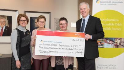 Transplant recipient Janice Corbin and her colleague Louise McNeely of Laxton Glass LLP present their law office’s donation to LHSC’s Deborah Kuhar and Dr. Anthony Jevnikar