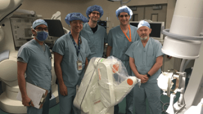 From left: Dr. Jonathan Lau, Dr. Kieth MacDougall, Dr. Holger Joswig, Dr. David Steven and Dr. Andrew Parrent. London Health Sciences Centre (LHSC) neurosurgeons pose for a photo during a training session on the hospital's newly acquired Renishaw Neuromate stereotactic surgical robot.
