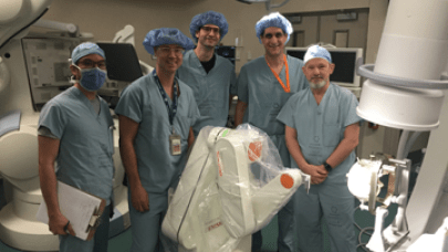 From left: Dr. Jonathan Lau, Dr. Kieth MacDougall, Dr. Holger Joswig, Dr. David Steven and Dr. Andrew Parrent. London Health Sciences Centre (LHSC) neurosurgeons pose for a photo during a training session on the hospital's newly acquired Renishaw Neuromate stereotactic surgical robot.